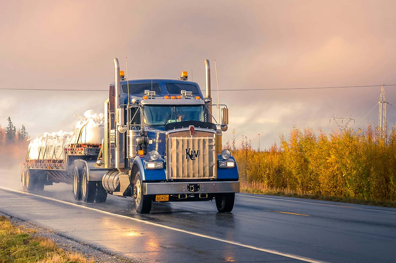 Truck on highway at golden hour